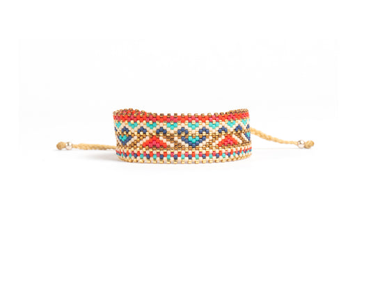 Pulsera Miyuki grande lineas doradas y grecas rojo azul